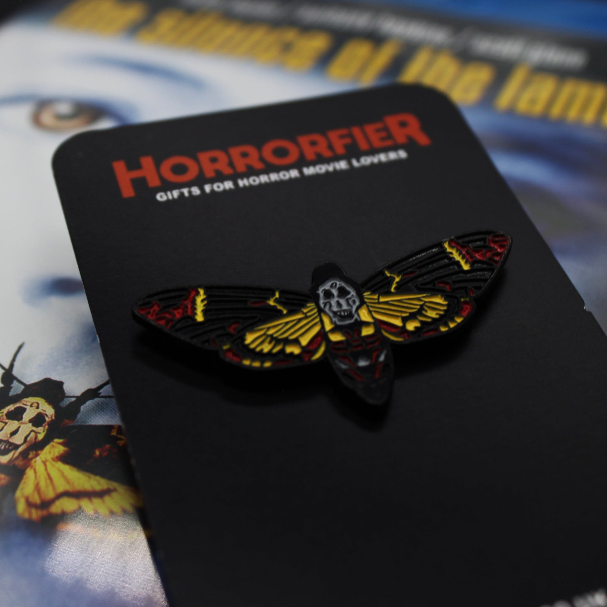 Close up of The Silence of the Lambs pinbadge by Horrororfier on The Silence of the Lambs Blu Ray Cover for size comparison