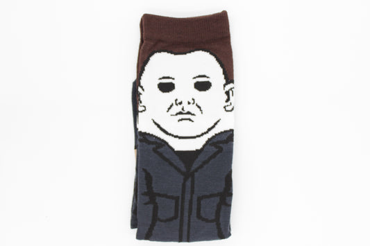 A pair of novelty socks featuring a stylised graphic of Michael Myers from the Halloween movies.