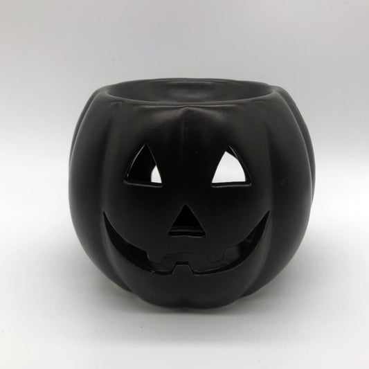 Matt black ceramic jack o lantern pumpkin wax burner by Horrorfier