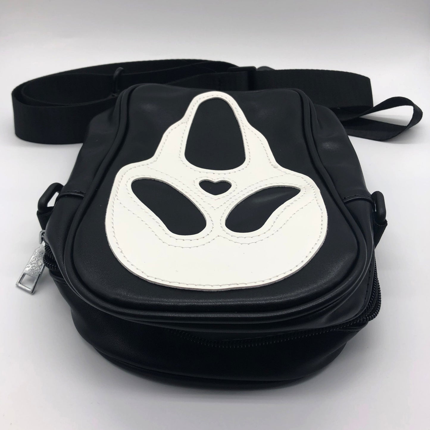 Top view of the zip from the Ghostface shoulder bag by Horrorfier