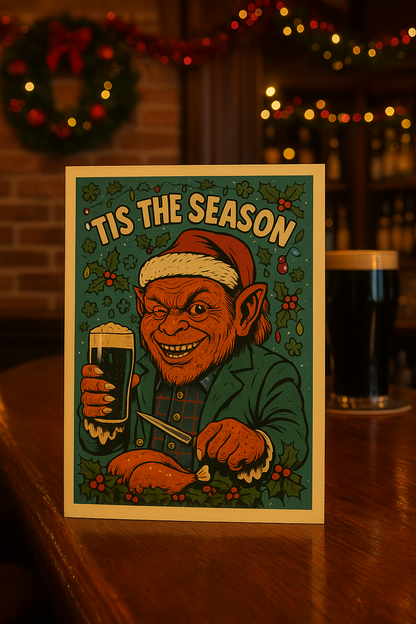 The Leprechaun Christmas Card featuring the Leprechaun enjoying his Christmas turkey dinner with a pint of Guinness.